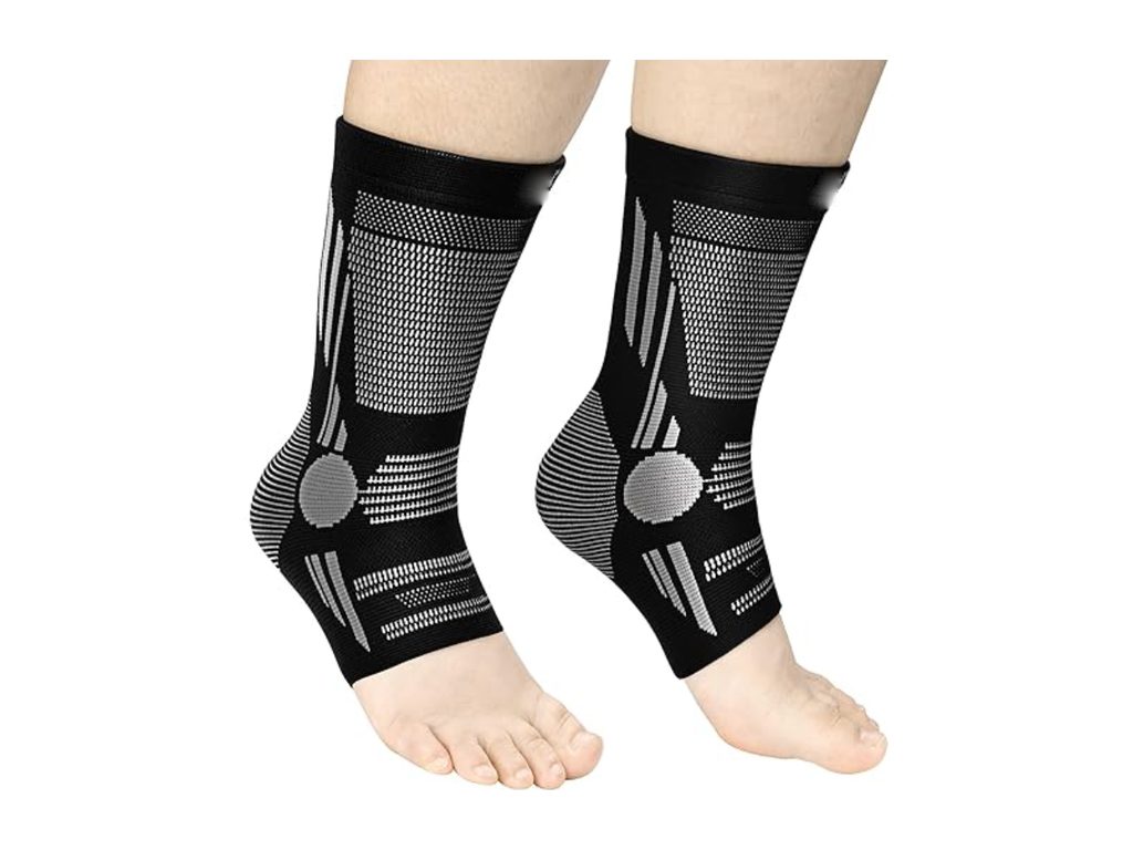 Pair of black and grey knitted ankle sleeves with open heel and toe and a round patch at each ankle bone
